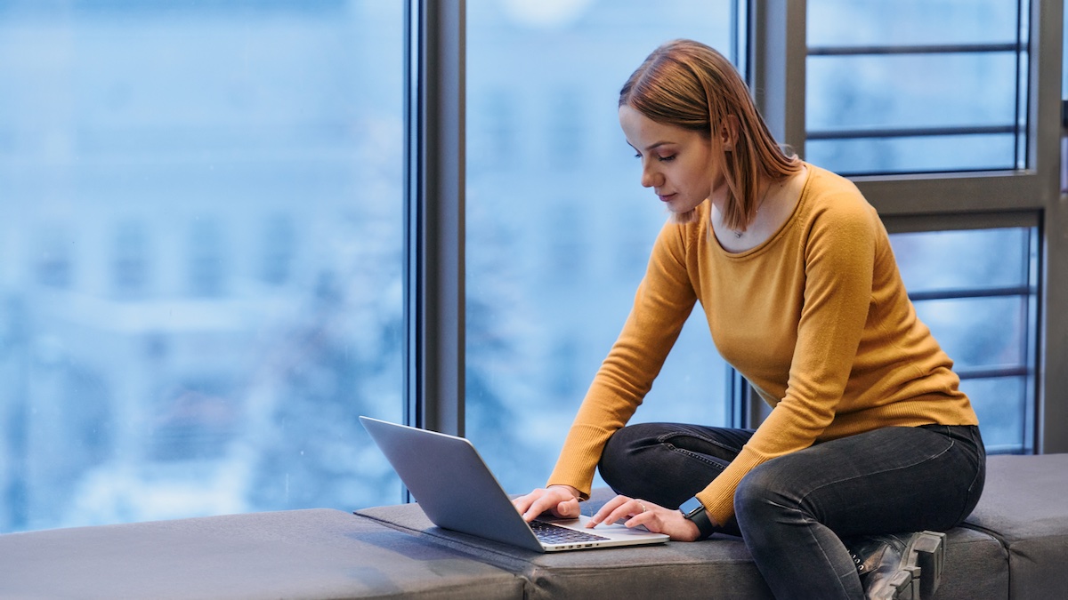 Business woman looking at her Desk Booking Software