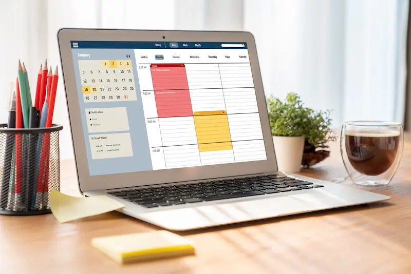 laptop with Desk Booking Calendar